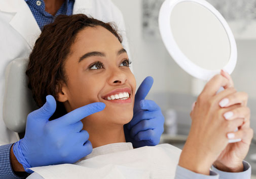 Dental patient looking in mirror